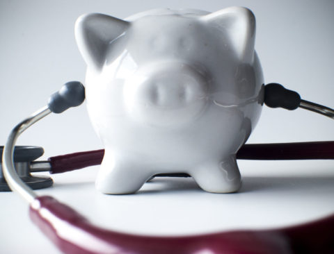 A piggybank with a stethoscope