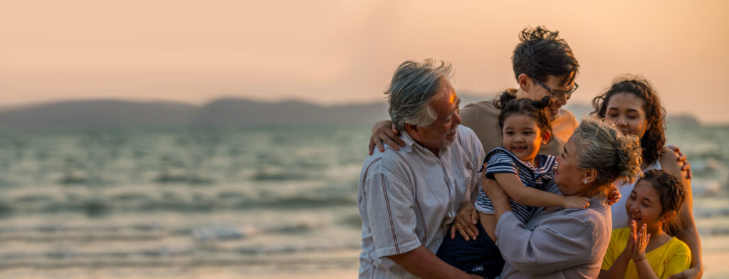 Intergenerational family on beach